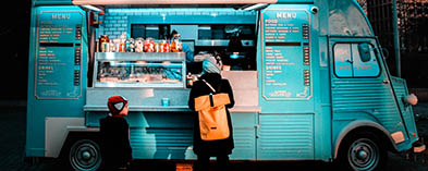 Food truck with person buying food