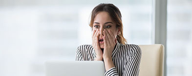 Shocked young women in front of computer