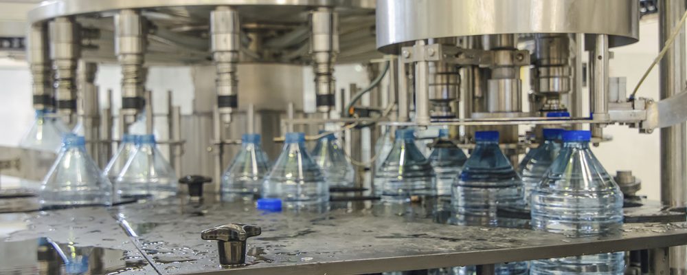 Water bottles moving through bottling plant