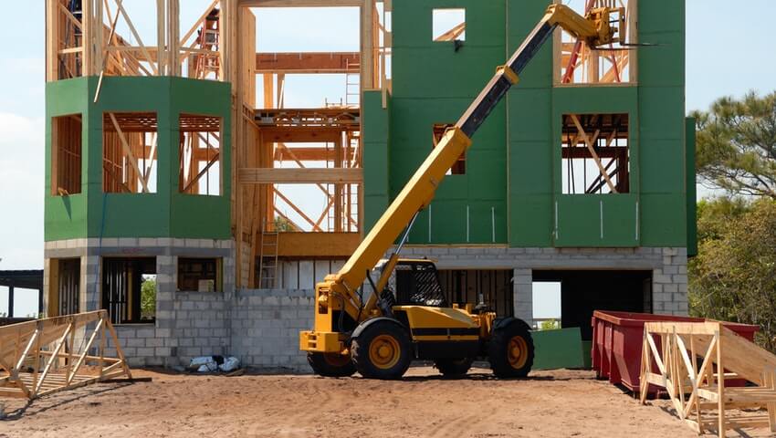 Framework of a house with boom lift