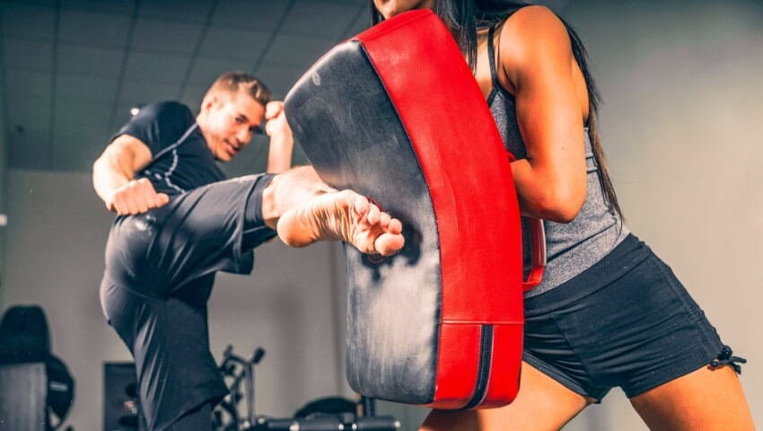 Man and woman training in gym