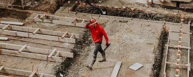 tradesman walking through construction site